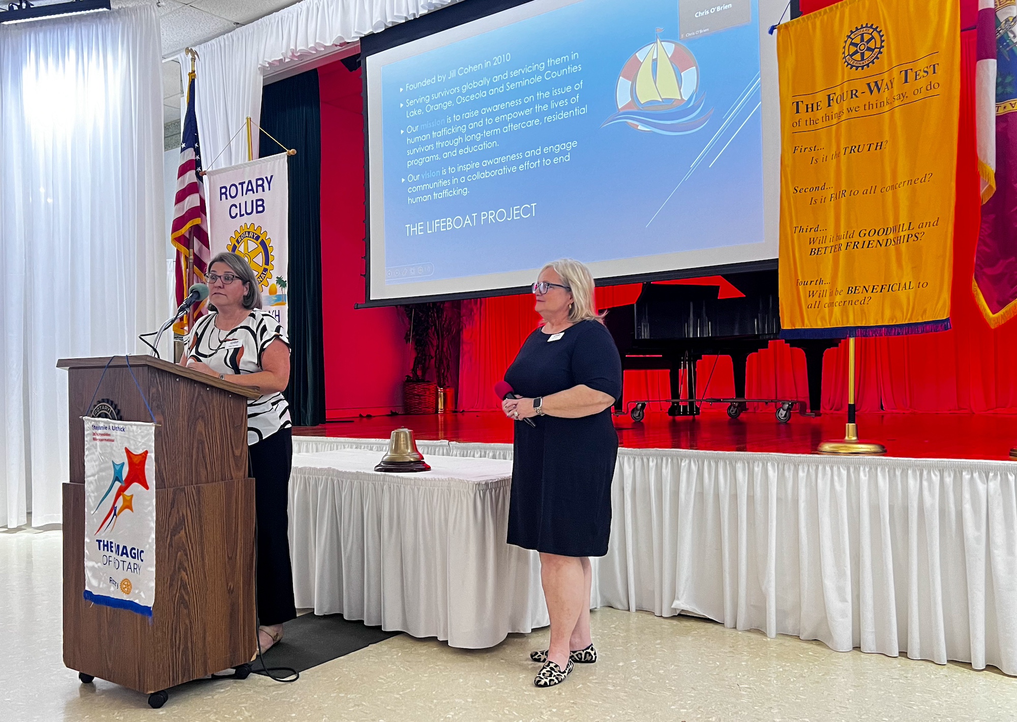 Eme and Jill speaking at Rotary Club meeting